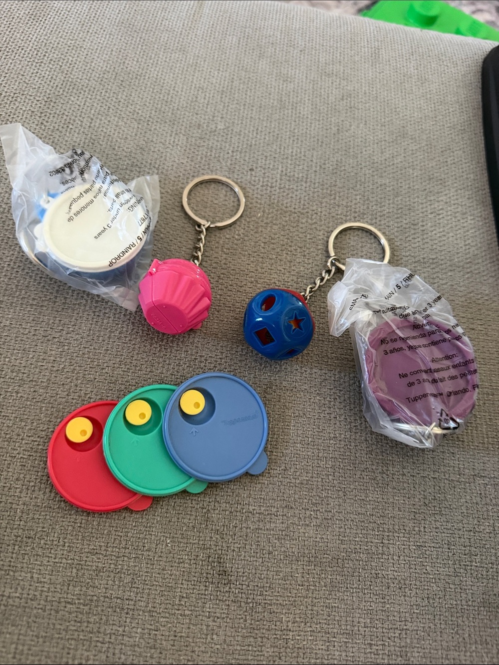 Assorted Tupperware keychains and 1 magnet New